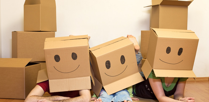 family wears boxes on their heads